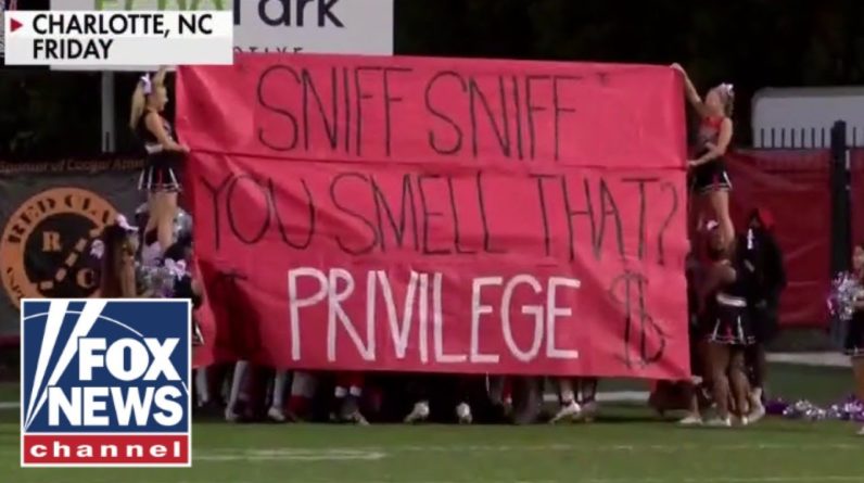 Parents outraged over 'privileged' sign at high school football game