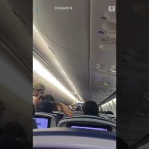 Some passengers on a Delta flight leaving Atlanta applaud announcement that masks were now optional.