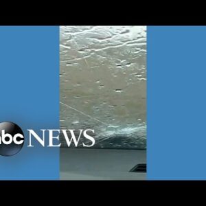 Large hailstones crack car windshield