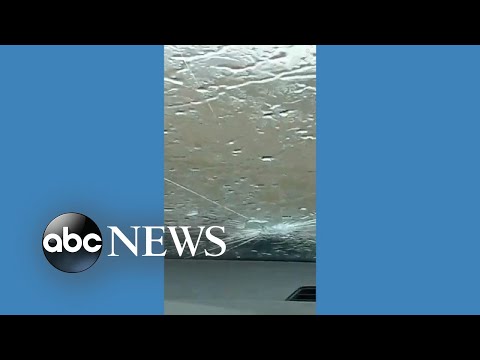 Large hailstones crack car windshield