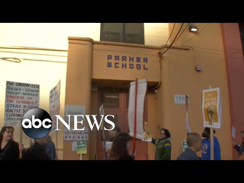 Teachers and parents protest over school closures in Oakland