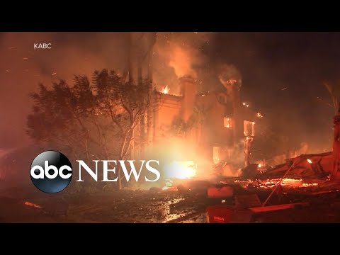 California wildfires burn through coastal neighborhood