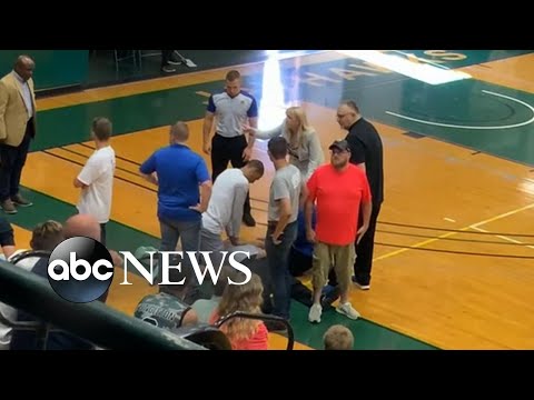 Basketball player saves referee