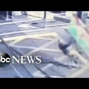 Cyclist crashes into barriers ahead of approaching train