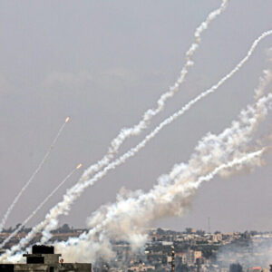 Palestinian terrorists fire rockets from the Gaza Strip toward Israel on May 13, 2023. (Said Khatib/AFP)