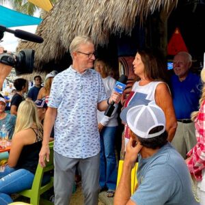 Fox & Friends' Steve Doocy talks to showgoers at Tiki 52 in Tequesta on Friday.