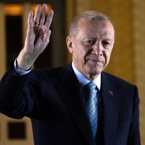 Chris McGrath/Getty ImagesPresident Recep Tayyip Erdogan gestures to supporters at the presidential palace after winning the presidential runoff in Ankara