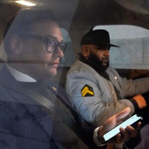 Rep. George Santos departs Capitol Hill in Washington on Wednesday, Jan. 11, 2023. (AP Photo/Patrick Semansky)