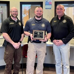 Sheriff's Deputy Caleb Conley (center) has died after being shot during a traffic stop outside of Lexington on May 22, 2023. (Scott County Sheriff's Office)
