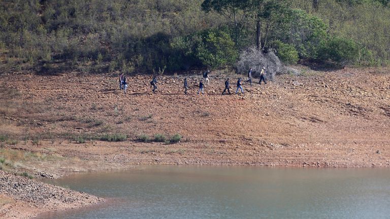 Personnel at Barragem do Arade reservoir, in the Algave, Portugal, as searches continue as part of the investigation into the disappearance of Madeleine McCann.