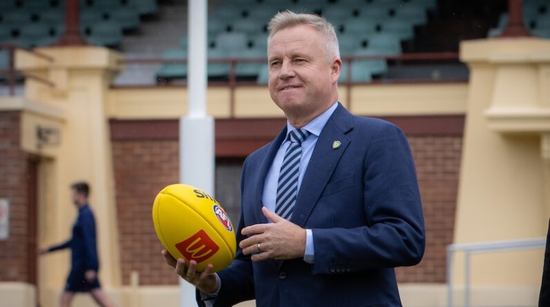 Jeremy Rockliff with a football.