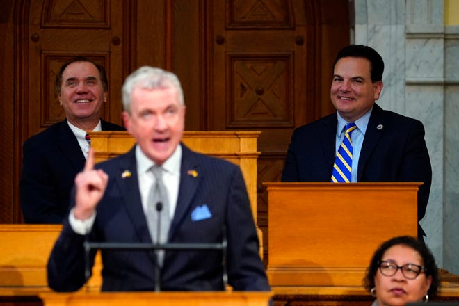 Assembly Speaker Craig Coughlin, far left, and Senate President Nick Scutari, far right, look on during Gov. Phil Murphy's budget speech at the New Jersey Statehouse on Tuesday, 28 February 2023.