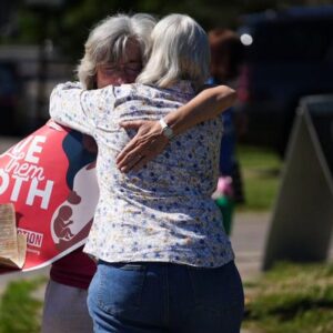 Mari Schoen of Gahanna hugs a fellow supporter as they celebrate the Supreme Court's overturning of Roe v Wade as they stand outside the Planned Parenthood Clinic on East Main Street in Columbus in June 2022.