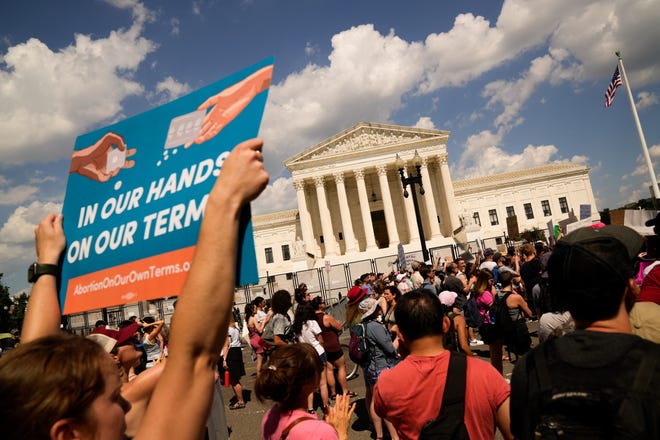 Abortion rights protesters take part in a rally outside the Supreme Court building the day after the court's decision in Dobbs v. Jackson Women's Health Organization on June 25, 2022.