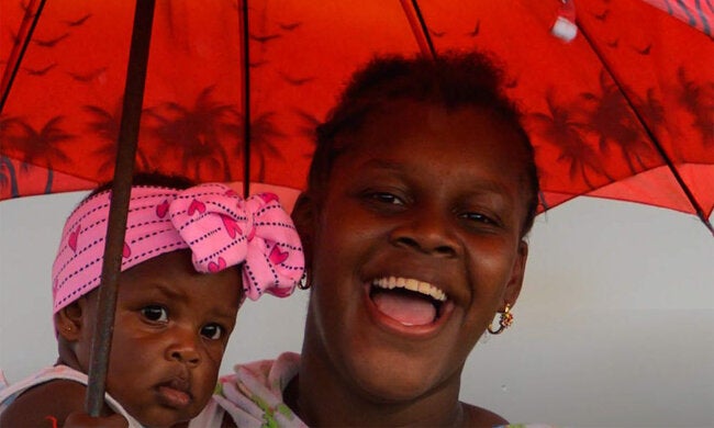 woman smiling baby red umbrella